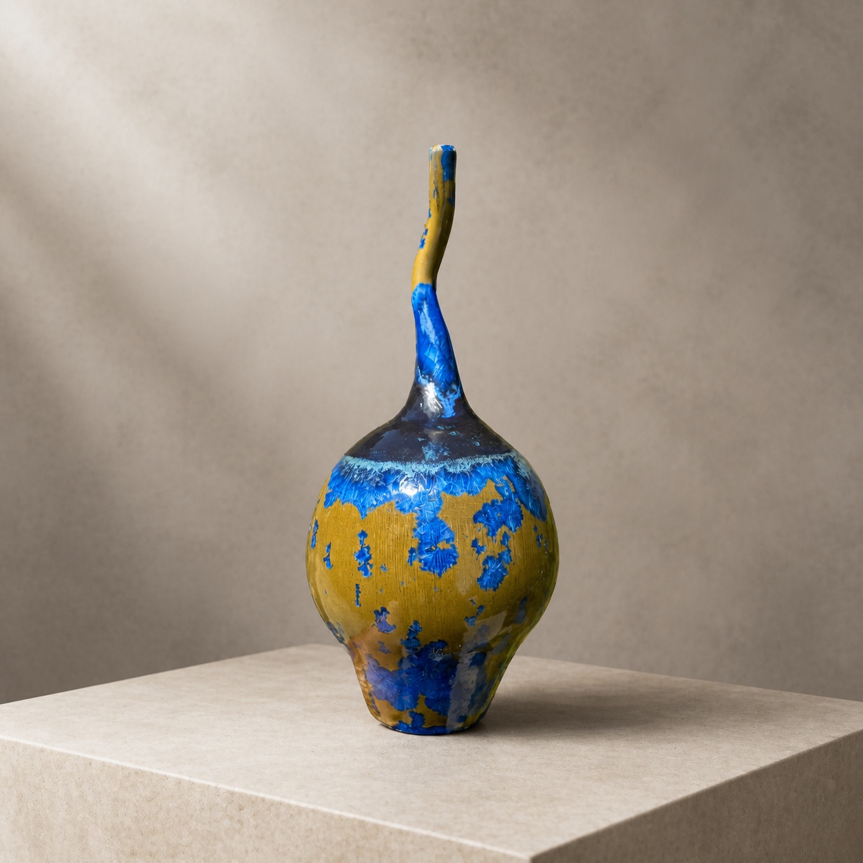 Blue and gold crystalline bottle with an asymmetrical neck by Mark Barta