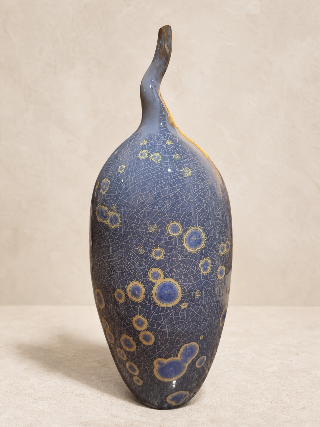 Blue and gold asymmetrical crystalline-glazed ceramic bottle by Mark Barta