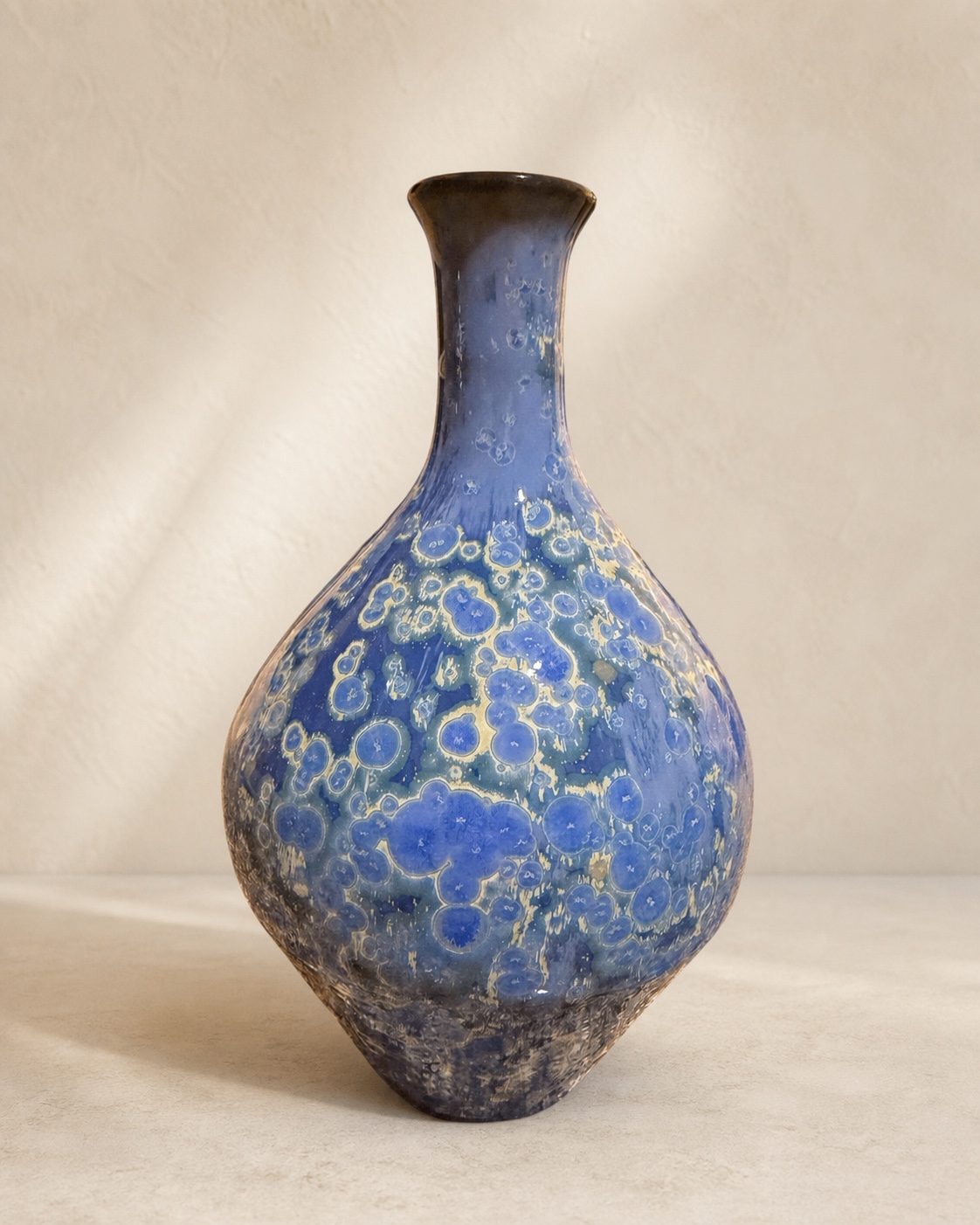 Blue and gold bulbous crystalline-glazed ceramic bottle by Mark Barta