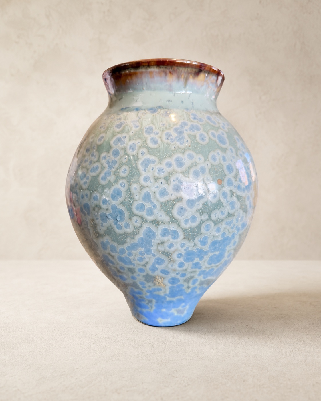Rounded celadon and blue crystalline-glazed ceramic vase by Mark Barta
